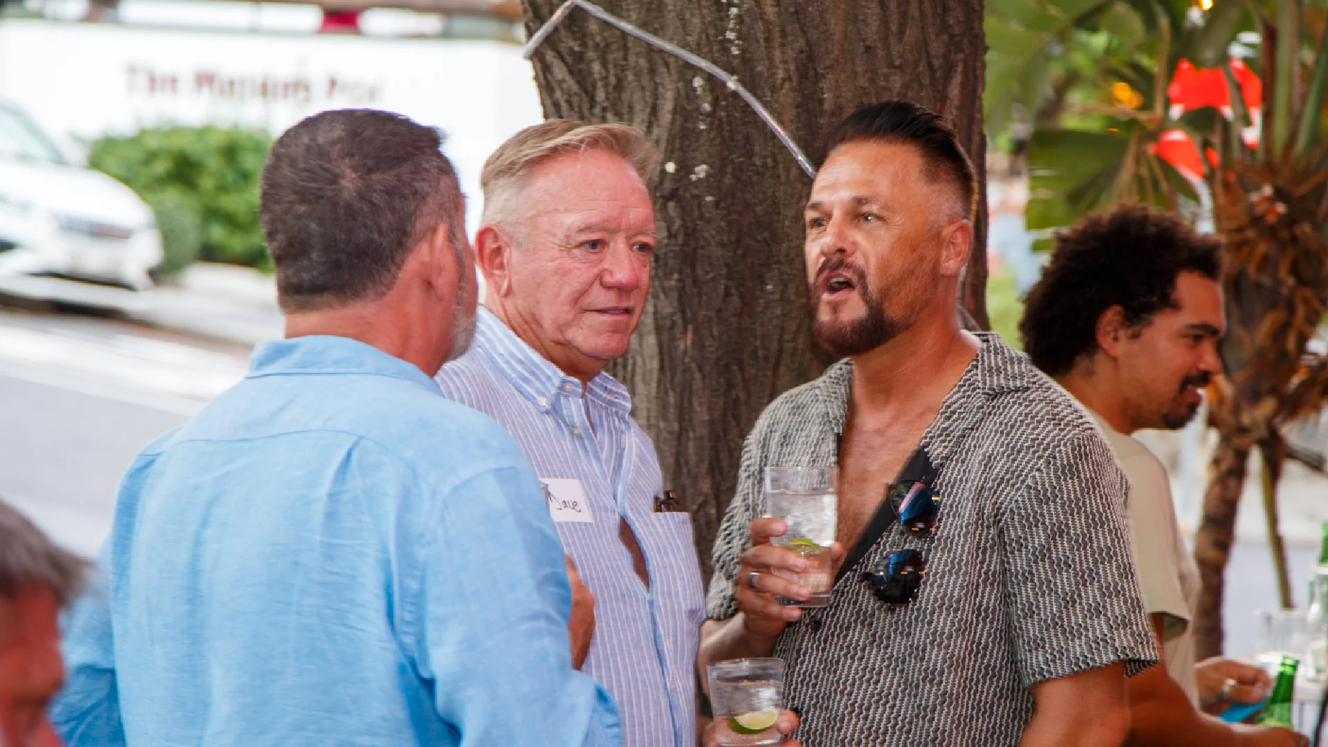 Attendees socialising during a Village Drinks event
